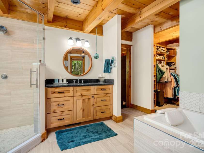 492 Henry Mountain Road, Brevard, NC 28712.  MLS# CAR4278583, YatesRealty ID 31855. Primary closet is off the bathroom.