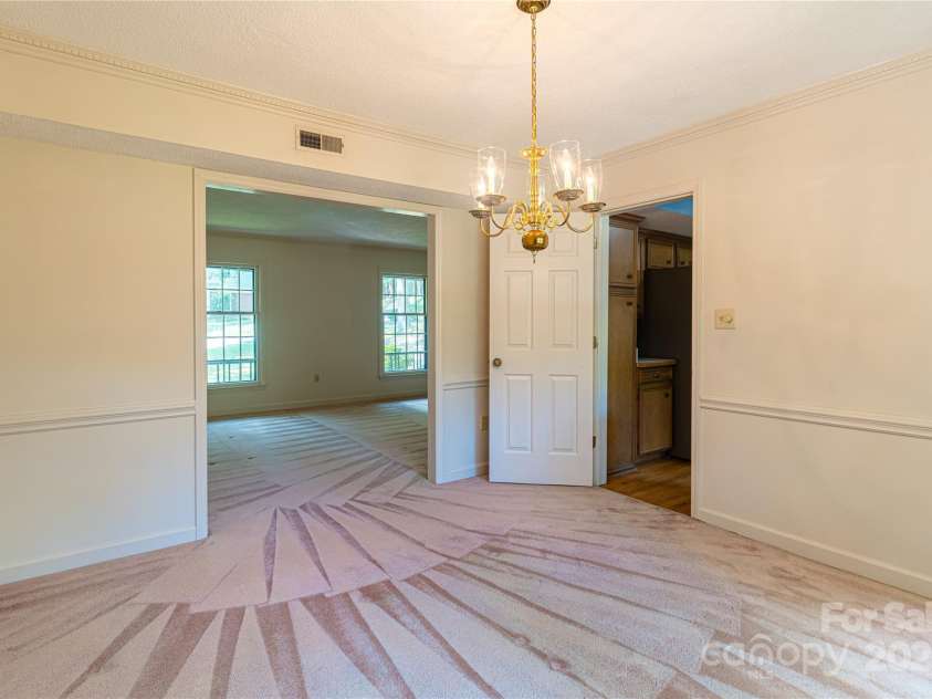 2011 Barden Road, Charlotte, NC 28226.  MLS# CAR4278483, YatesRealty ID 31858. Dining room with view to living room and kitchen.