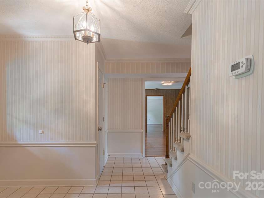 2011 Barden Road, Charlotte, NC 28226.  MLS# CAR4278483, YatesRealty ID 31858. Foyer with view into the den.