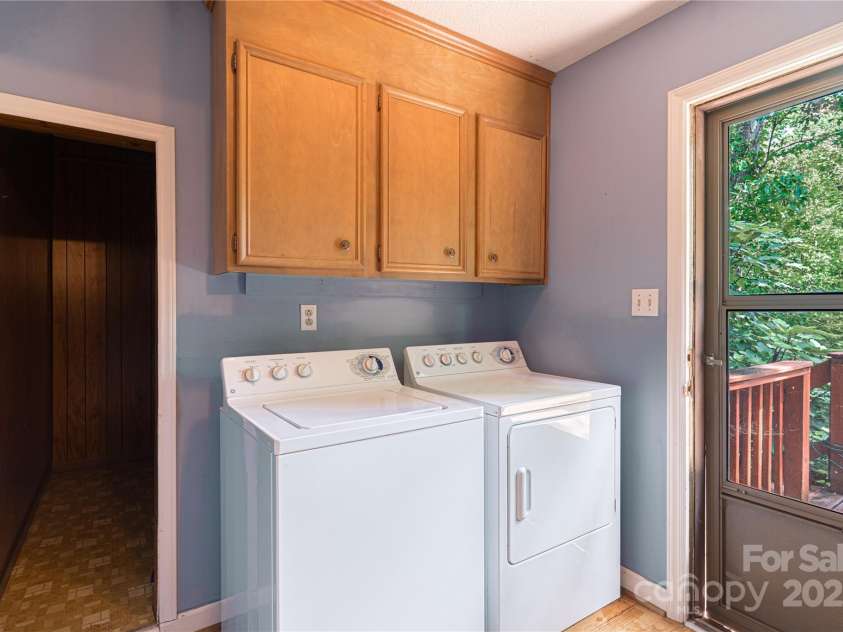 2011 Barden Road, Charlotte, NC 28226.  MLS# CAR4278483, YatesRealty ID 31858. Laundry room downstairs with view of storage.