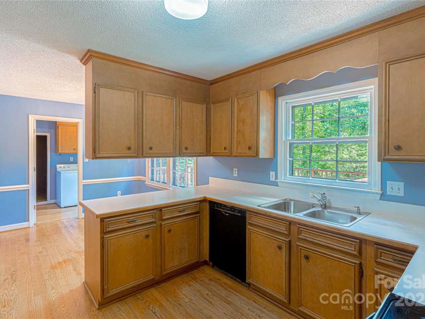 2011 Barden Road, Charlotte, NC 28226.  MLS# CAR4278483, YatesRealty ID 31858. View to laundry and storage rooms and exit to back deck.
