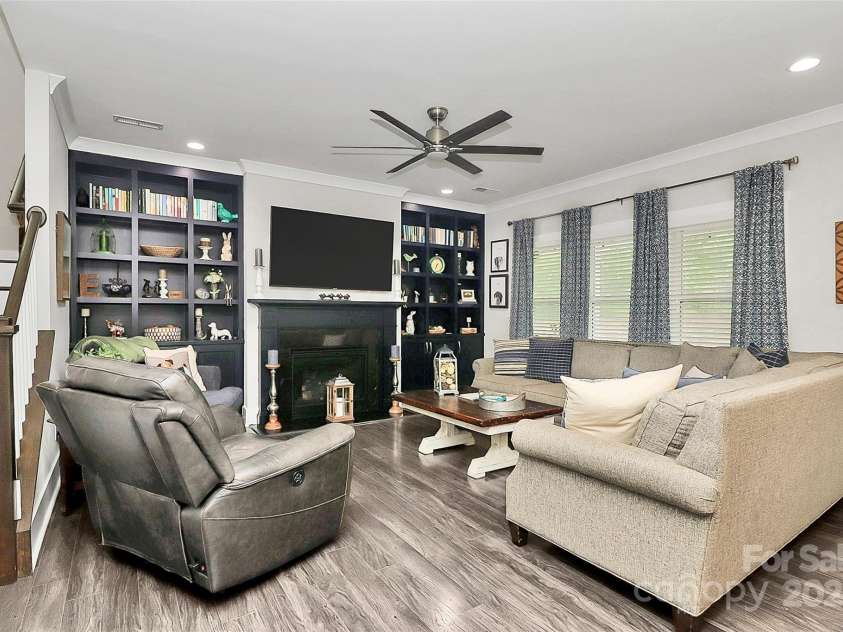 3536 Arnica Court, Tega Cay, SC 29708.  MLS# CAR4290061, YatesRealty ID 31866. Fireplace flanked with built-in shelves in Family Room