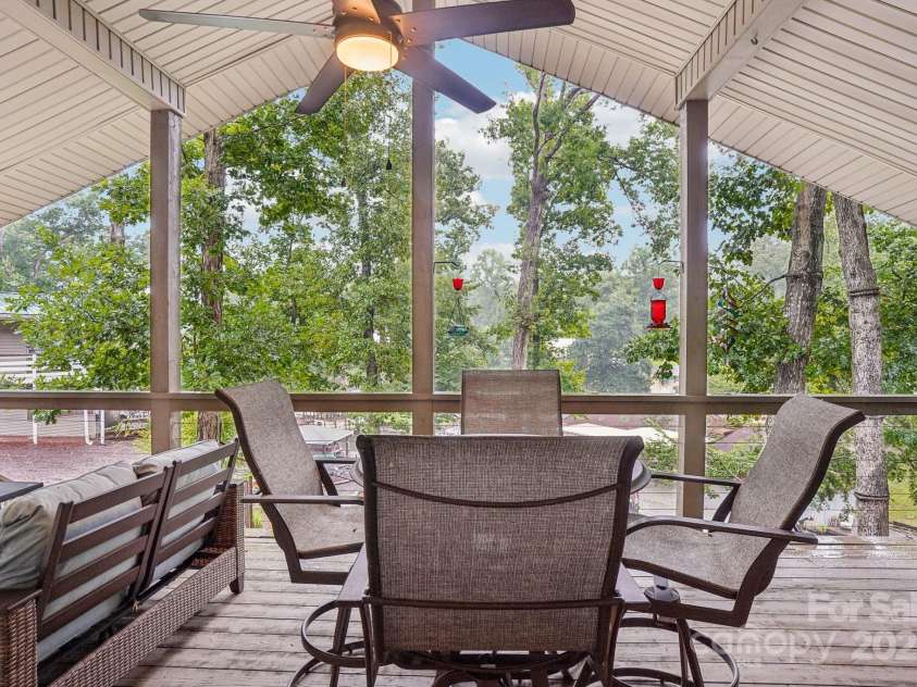 500 Deerfield Road, Mount Gilead, NC 27306.  MLS# CAR4289933, YatesRealty ID 31868. Large, covered porch on the water side