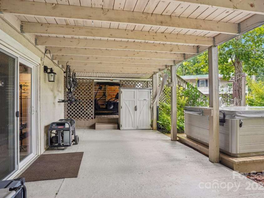 500 Deerfield Road, Mount Gilead, NC 27306.  MLS# CAR4289933, YatesRealty ID 31868. Relax in your hot tub on cool evenings at the lake!