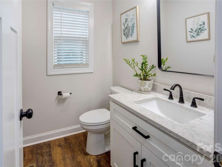 317 Oak Brook Drive, Salisbury, NC 28146.  MLS# CAR4394271, YatesRealty ID 31871. Downstairs half bath inside the garage hallway.