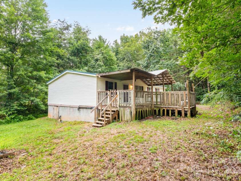 28 Myrtle Road, Swannanoa, NC 28778.  MLS# CAR4289376, YatesRealty ID 31872. Back of home and yard space