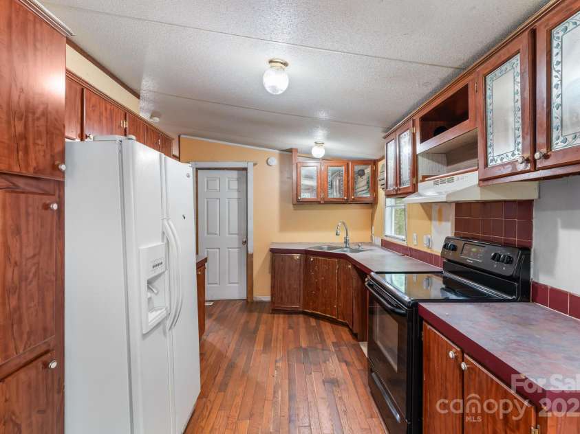 28 Myrtle Road, Swannanoa, NC 28778.  MLS# CAR4289376, YatesRealty ID 31872. Kitchen from the dining room