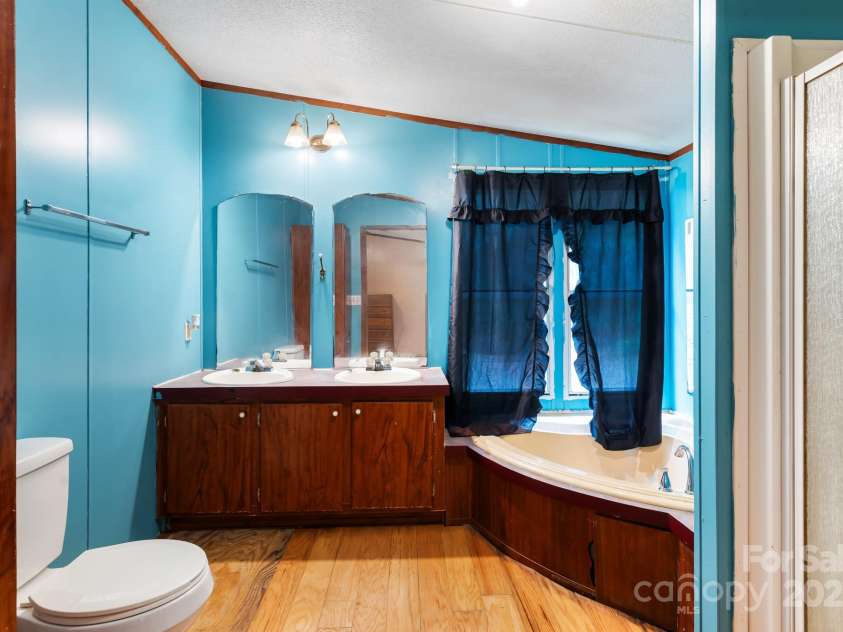 28 Myrtle Road, Swannanoa, NC 28778.  MLS# CAR4289376, YatesRealty ID 31872. Primary bathroom with garden tub and shower