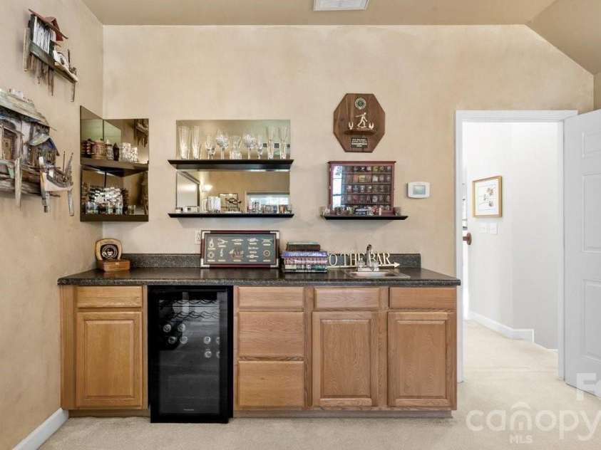 8716 Devonshire Drive, Huntersville, NC 28078.  MLS# CAR4377516, YatesRealty ID 31879. Wet bar area with built in wine refrigerator