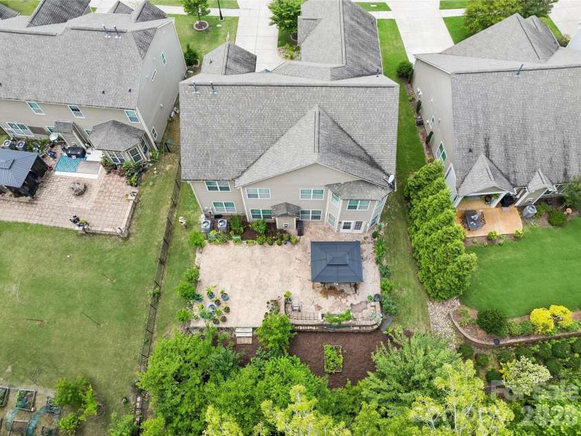 1345 Sandy Bottom Drive, Concord, NC 28027.  MLS# CAR4388399, YatesRealty ID 31881. Aerial Backyard View