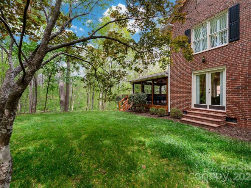 2306 Beechwood Drive, Waxhaw, NC 28173.  MLS# CAR4249221, YatesRealty ID 31885. Side yard with French doors to Family Room