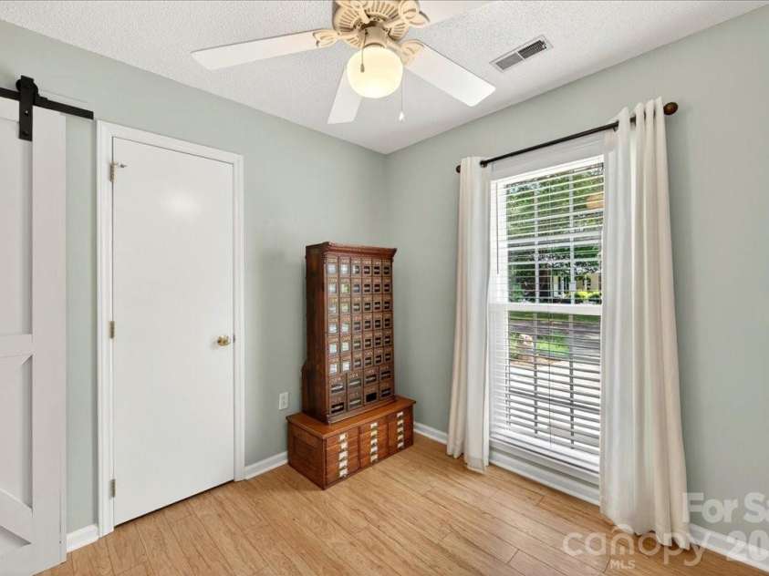 7306 Carrbridge Lane, Charlotte, NC 28226.  MLS# CAR4390862, YatesRealty ID 31888. Great natural light barn door for easy access and engineered hardwoods!