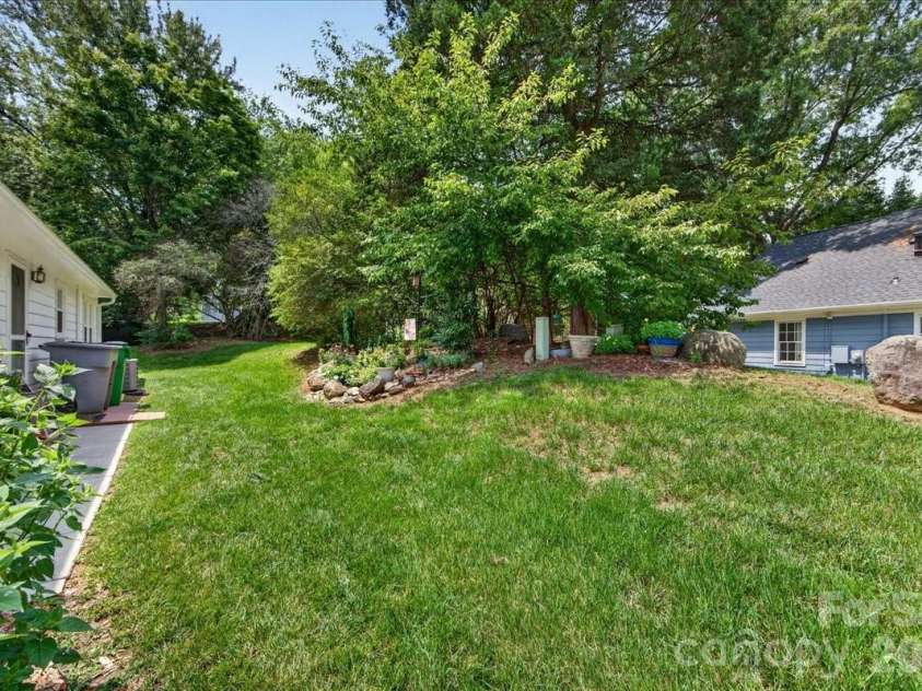 7306 Carrbridge Lane, Charlotte, NC 28226.  MLS# CAR4390862, YatesRealty ID 31888. Mowing, mulching, and trimming is maintained by the HOA!