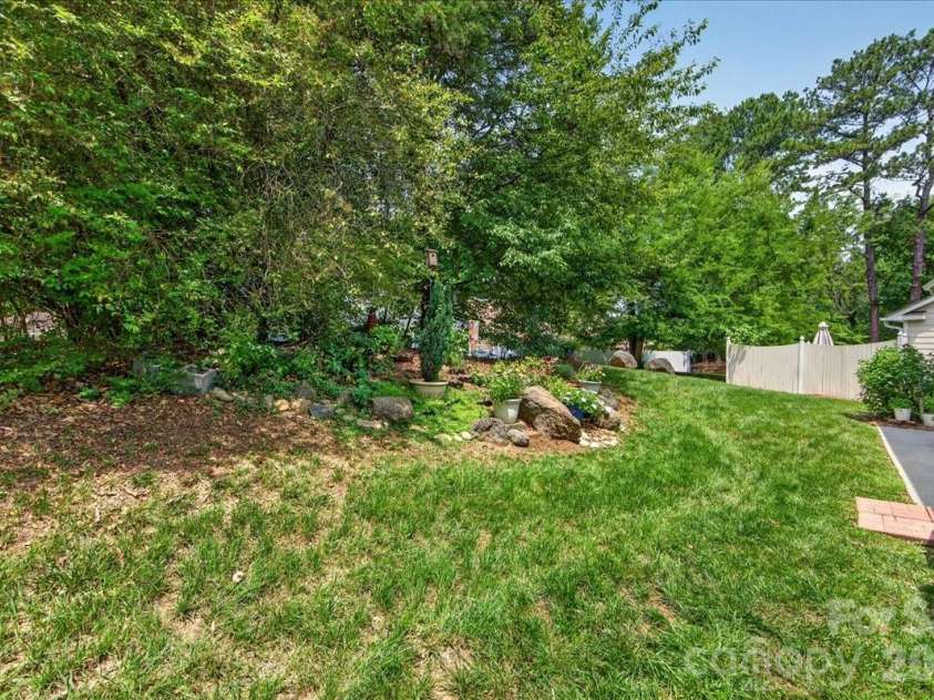 7306 Carrbridge Lane, Charlotte, NC 28226.  MLS# CAR4390862, YatesRealty ID 31888. Private backyard with thoughtful landscaping!