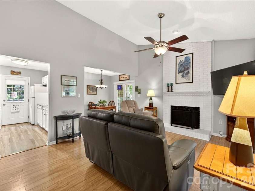7306 Carrbridge Lane, Charlotte, NC 28226.  MLS# CAR4390862, YatesRealty ID 31888. Vaulted ceiling with a brick fireplace as the focal point!