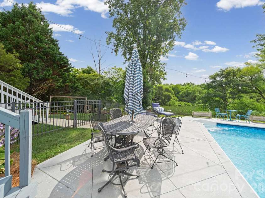 10203 Rougemont Lane, Charlotte, NC 28277.  MLS# CAR4394772, YatesRealty ID 31890. Private backyard backs to the Greenway, creating a natural buffer and backdrop