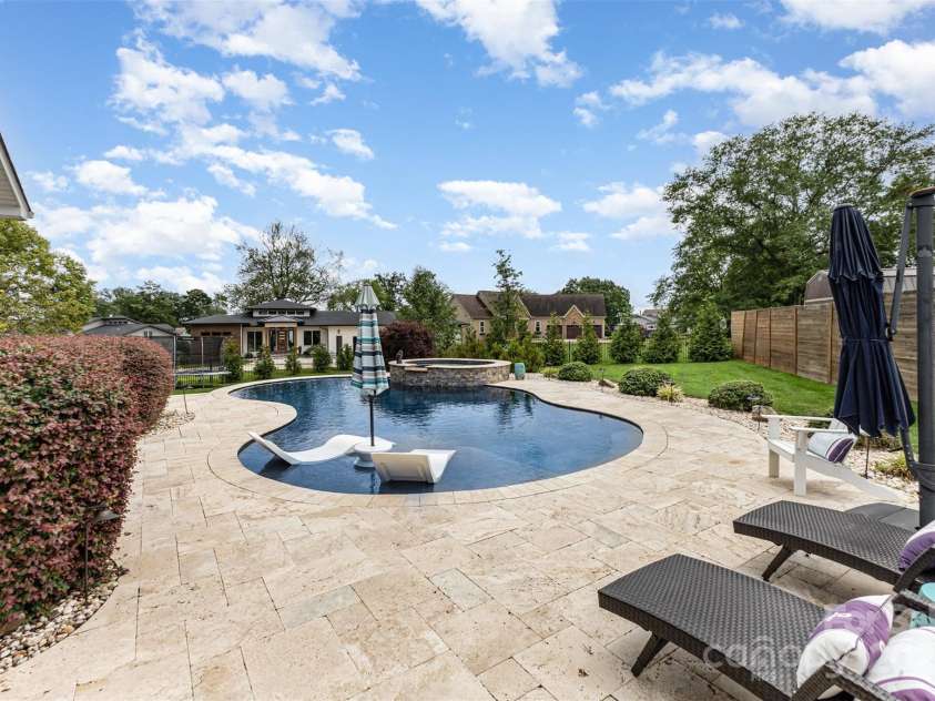 2611 Ranger Island Road, Denver, NC 28037.  MLS# CAR4290507, YatesRealty ID 31894. Backyard with Salt Water Pool and Travertine Pool Deck