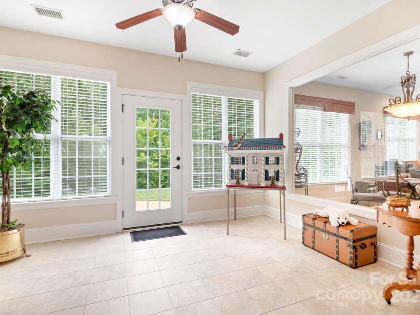 12632 Meetinghouse Drive, Cornelius, NC 28031.  MLS# CAR4287624, YatesRealty ID 31899. Bright Sunroom with window wall to kitchen