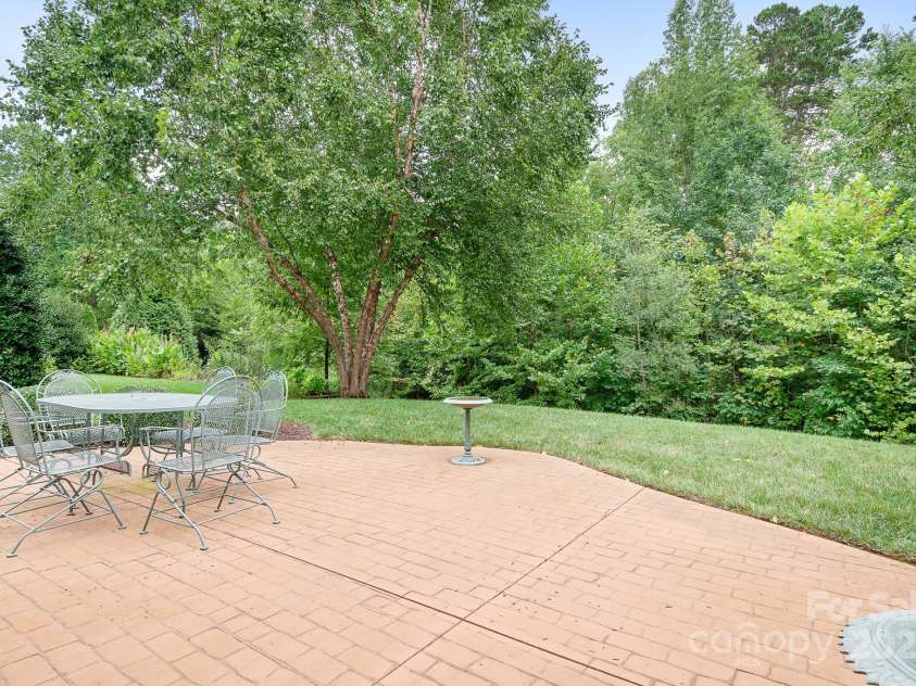 12632 Meetinghouse Drive, Cornelius, NC 28031.  MLS# CAR4287624, YatesRealty ID 31899. Patio space from sunroom