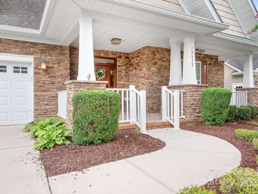 12632 Meetinghouse Drive, Cornelius, NC 28031.  MLS# CAR4287624, YatesRealty ID 31899. Rocking chair front porch