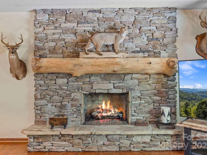 658 Johnson Road, Brevard, NC 28712.  MLS# CAR4300237, YatesRealty ID 319. 2 flue fireplace can be converted from electric to gas or wood burning