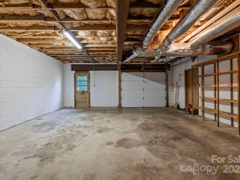 658 Johnson Road, Brevard, NC 28712.  MLS# CAR4300237, YatesRealty ID 319. Exlarge garage capable of containing 2 vehicles