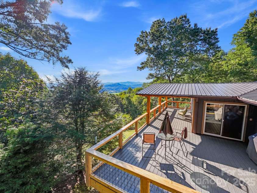 658 Johnson Road, Brevard, NC 28712.  MLS# CAR4300237, YatesRealty ID 319. Over 600 ft of trex decking for maintenance free enjoyment