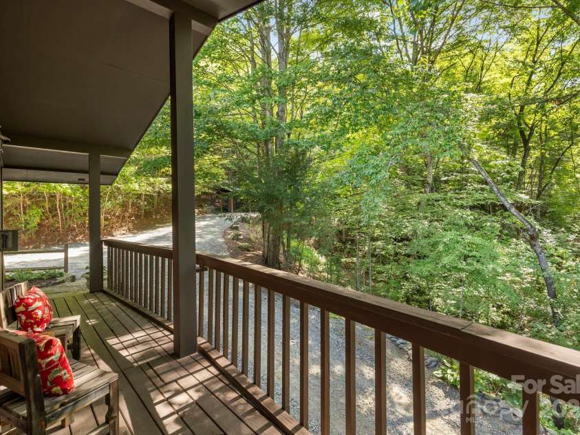 658 Johnson Road, Brevard, NC 28712.  MLS# CAR4300237, YatesRealty ID 319. Private porch off primary suite