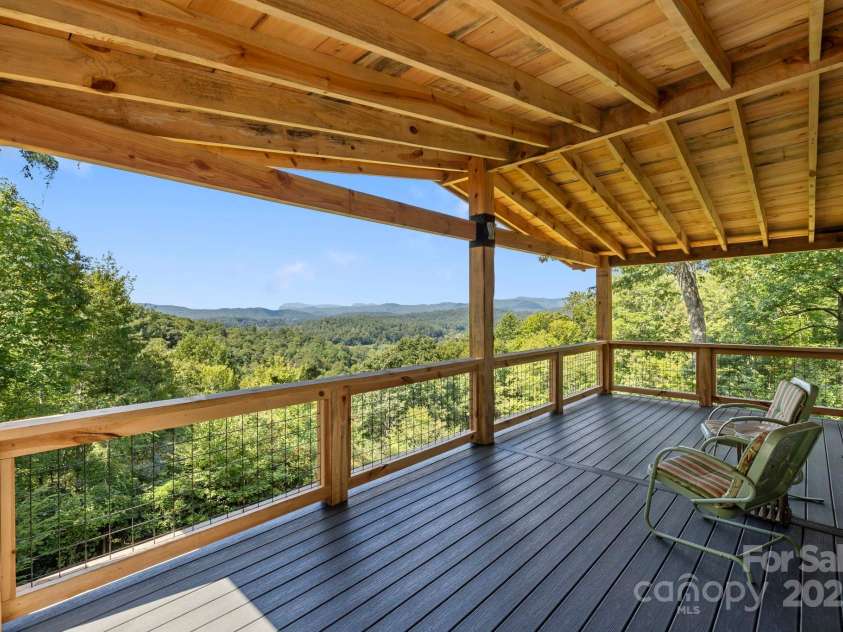 658 Johnson Road, Brevard, NC 28712.  MLS# CAR4300237, YatesRealty ID 319. Spacious covered deck is perfect for entertaining