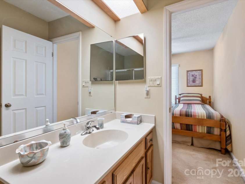 123 Deerlake Drive, Asheville, NC 28803.  MLS# CAR4235089, YatesRealty ID 3190. Bathroom #3 with View of Bedroom