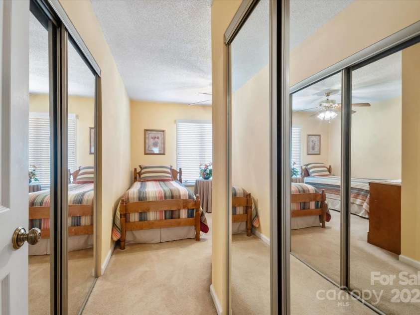 123 Deerlake Drive, Asheville, NC 28803.  MLS# CAR4235089, YatesRealty ID 3190. Bedroom #3 with View of Two Closets