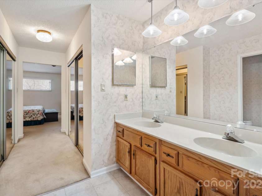 123 Deerlake Drive, Asheville, NC 28803.  MLS# CAR4235089, YatesRealty ID 3190. Primary Bathroom Looking Down the Hall