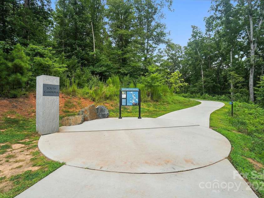 4012 Bainbridge Place, Fort Mill, SC 29707.  MLS# CAR4282310, YatesRealty ID 31905. Greenway Entrance on Gilroy Drive