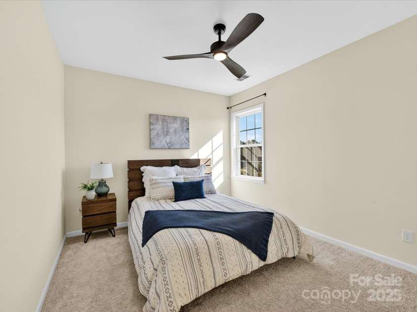 244 Bouchard Drive, Waxhaw, NC 28173.  MLS# CAR4312456, YatesRealty ID 3191. 3rd Bedroom with plush carpet, ceiling fan and light !