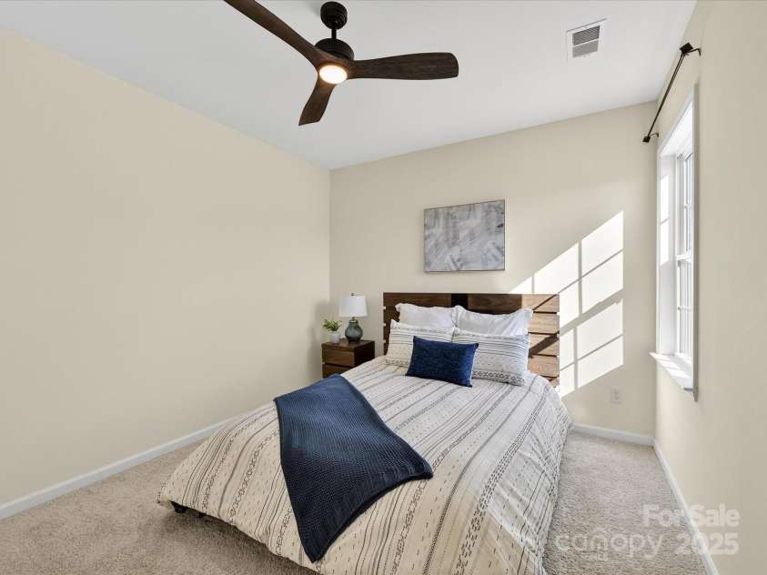 244 Bouchard Drive, Waxhaw, NC 28173.  MLS# CAR4312456, YatesRealty ID 3191. 3rd Bedroom with plush carpet, ceiling fan and light !