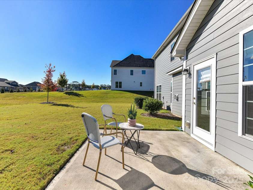 244 Bouchard Drive, Waxhaw, NC 28173.  MLS# CAR4312456, YatesRealty ID 3191. Back Patio