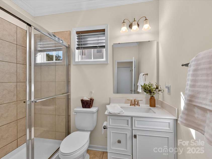 244 Bouchard Drive, Waxhaw, NC 28173.  MLS# CAR4312456, YatesRealty ID 3191. Full bath on main level with walk in shower and upgraded vanity