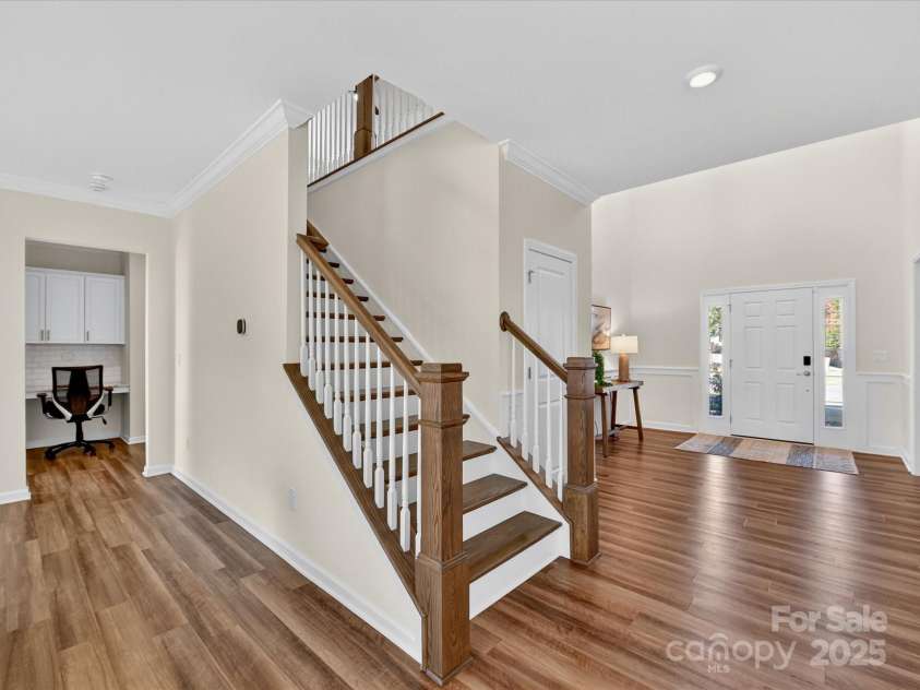 244 Bouchard Drive, Waxhaw, NC 28173.  MLS# CAR4312456, YatesRealty ID 3191. Main level staircase landing