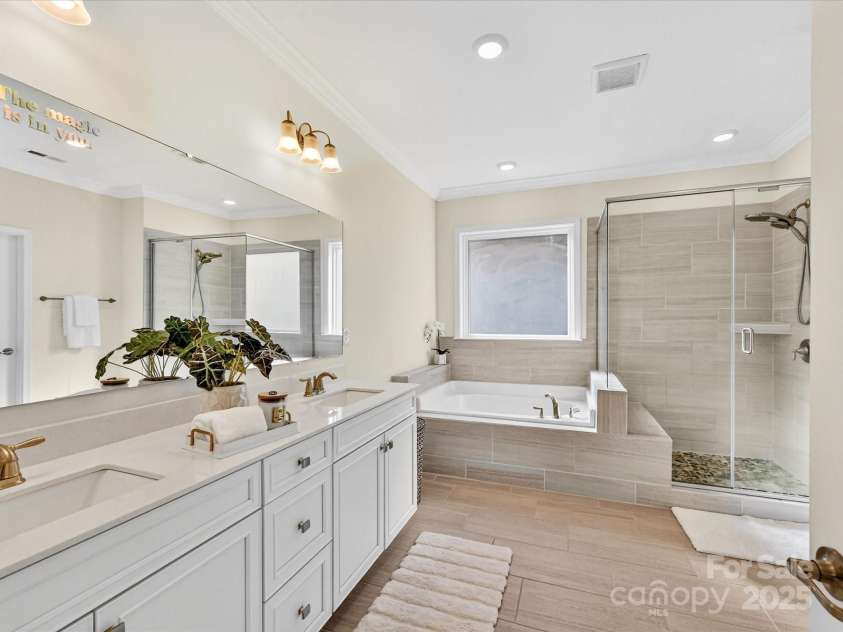244 Bouchard Drive, Waxhaw, NC 28173.  MLS# CAR4312456, YatesRealty ID 3191. Primary bath features dual vanity sinks, soaking tub and shower.  Walk in closet attached for convience 