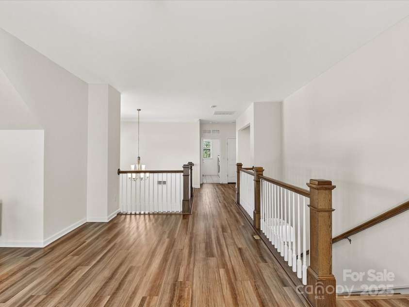 244 Bouchard Drive, Waxhaw, NC 28173.  MLS# CAR4312456, YatesRealty ID 3191. Second floor staircase landing