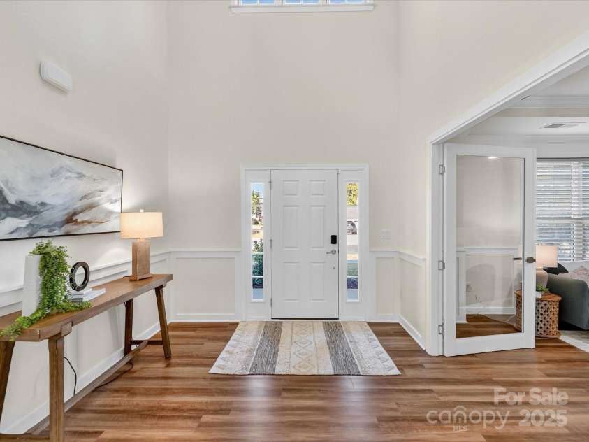 244 Bouchard Drive, Waxhaw, NC 28173.  MLS# CAR4312456, YatesRealty ID 3191. Two Story Foyer with transom and side panel windows!