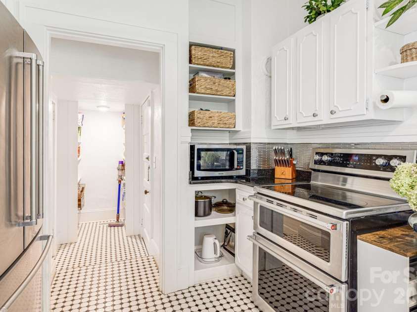 18 Robinwood Avenue, Asheville, NC 28806.  MLS# CAR4393836, YatesRealty ID 31910. Updated kitchen maintains its retro feel