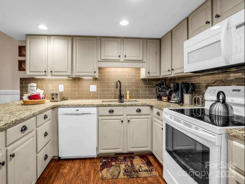 123 Mountain Village Boulevard, Lake Lure, NC 28746.  MLS# CAR4303567, YatesRealty ID 3192. Granite tiled Kit
