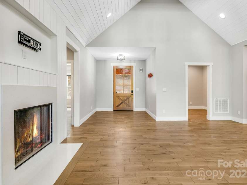 111 Oak Mountain Drive, Leicester, NC 28748.  MLS# CAR4289425, YatesRealty ID 31920. Living room looking towards front door and office 