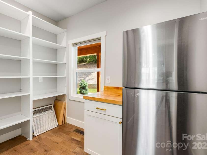 111 Oak Mountain Drive, Leicester, NC 28748.  MLS# CAR4289425, YatesRealty ID 31920. Spacious walk-in butler's pantry witth additional fridge