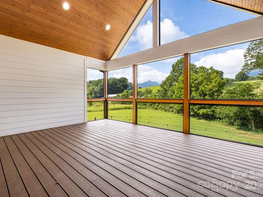 111 Oak Mountain Drive, Leicester, NC 28748.  MLS# CAR4289425, YatesRealty ID 31920. Stunning screened in porch off of the main living areas