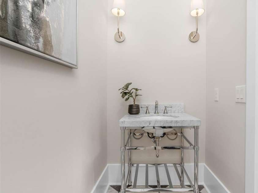 216 Walnut Street, Davidson, NC 28036.  MLS# CAR4300699, YatesRealty ID 31926. Main level powder room