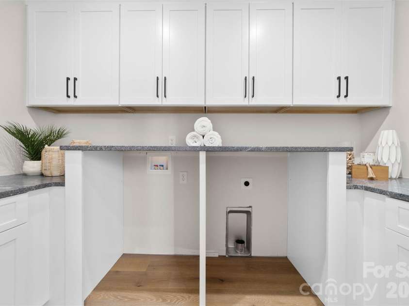 216 Walnut Street, Davidson, NC 28036.  MLS# CAR4300699, YatesRealty ID 31926. Second floor laundry room