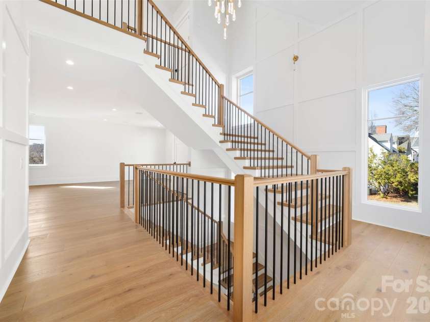 216 Walnut Street, Davidson, NC 28036.  MLS# CAR4300699, YatesRealty ID 31926. Stairs from the second floor to the third floor