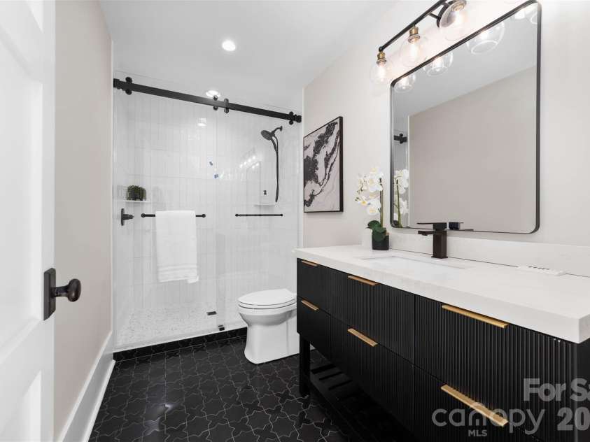 216 Walnut Street, Davidson, NC 28036.  MLS# CAR4300699, YatesRealty ID 31926. Third floor ensuite bathroom